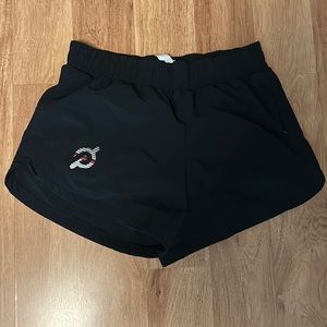 Black Peloton running shorts.
